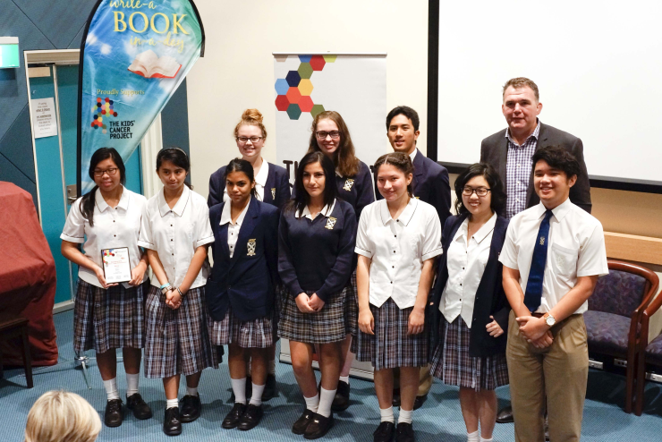 Students receiving their award for their winning book Malice.