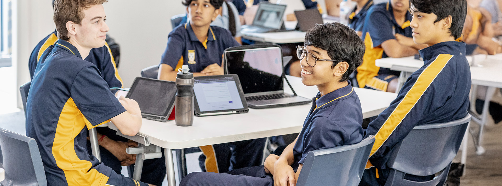 Students sitting at their desks in the classroom at St Andrews College Marayong