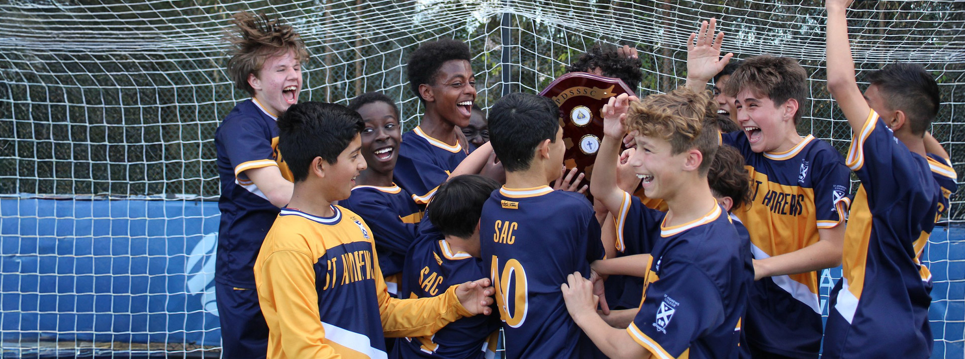 Students celebrating at sporting event at St Andrews College Marayong