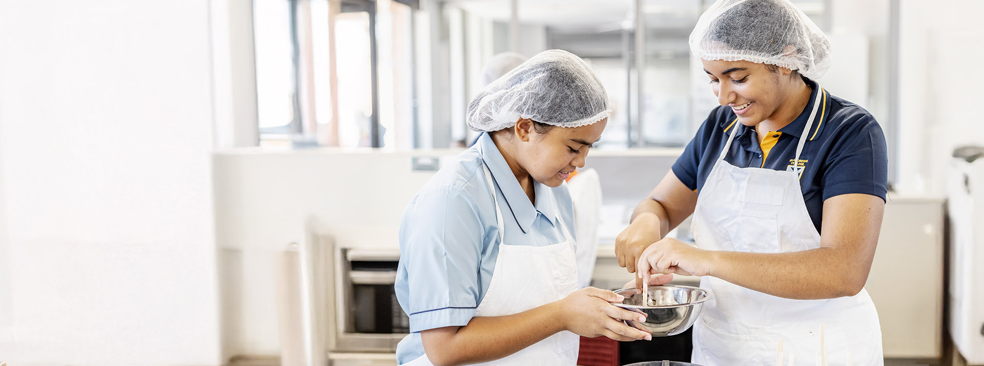 Students working together in the hospitality room at St Andrews College Marayong