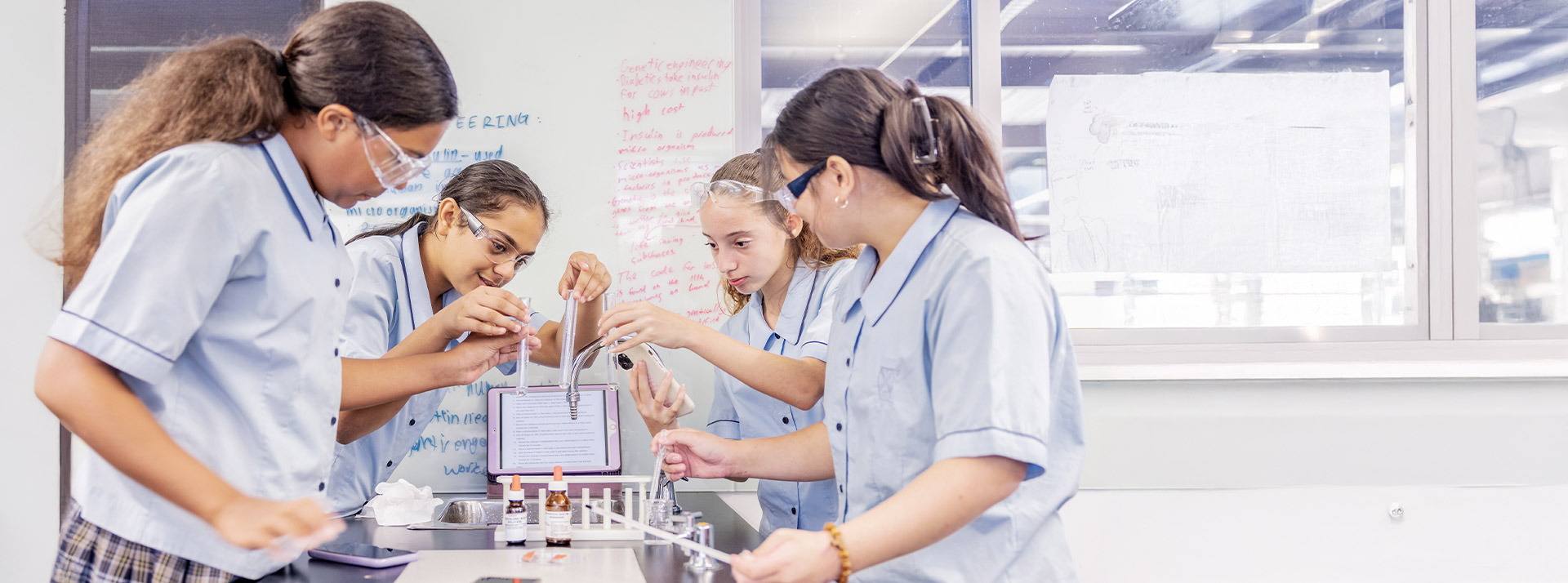 Students working in the science lab at St Andrews College Marayong