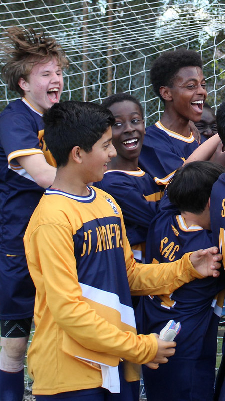 Students celebrating at sporting event at St Andrews College Marayong