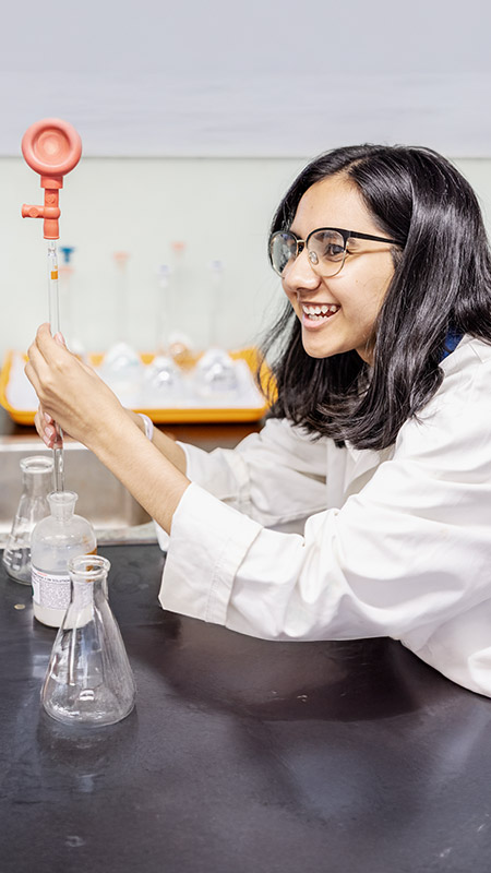 Student working in the science lab at St Andrews College Marayong